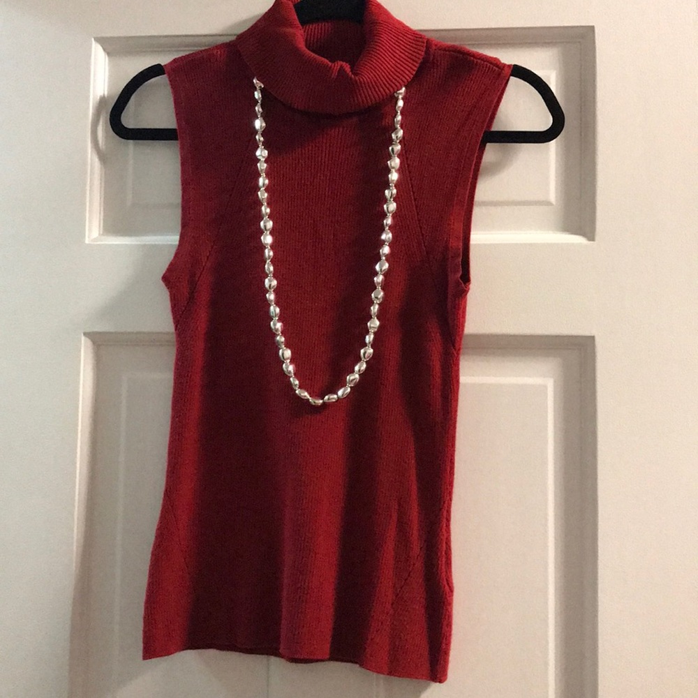 Red sleeveless turtleneck tank